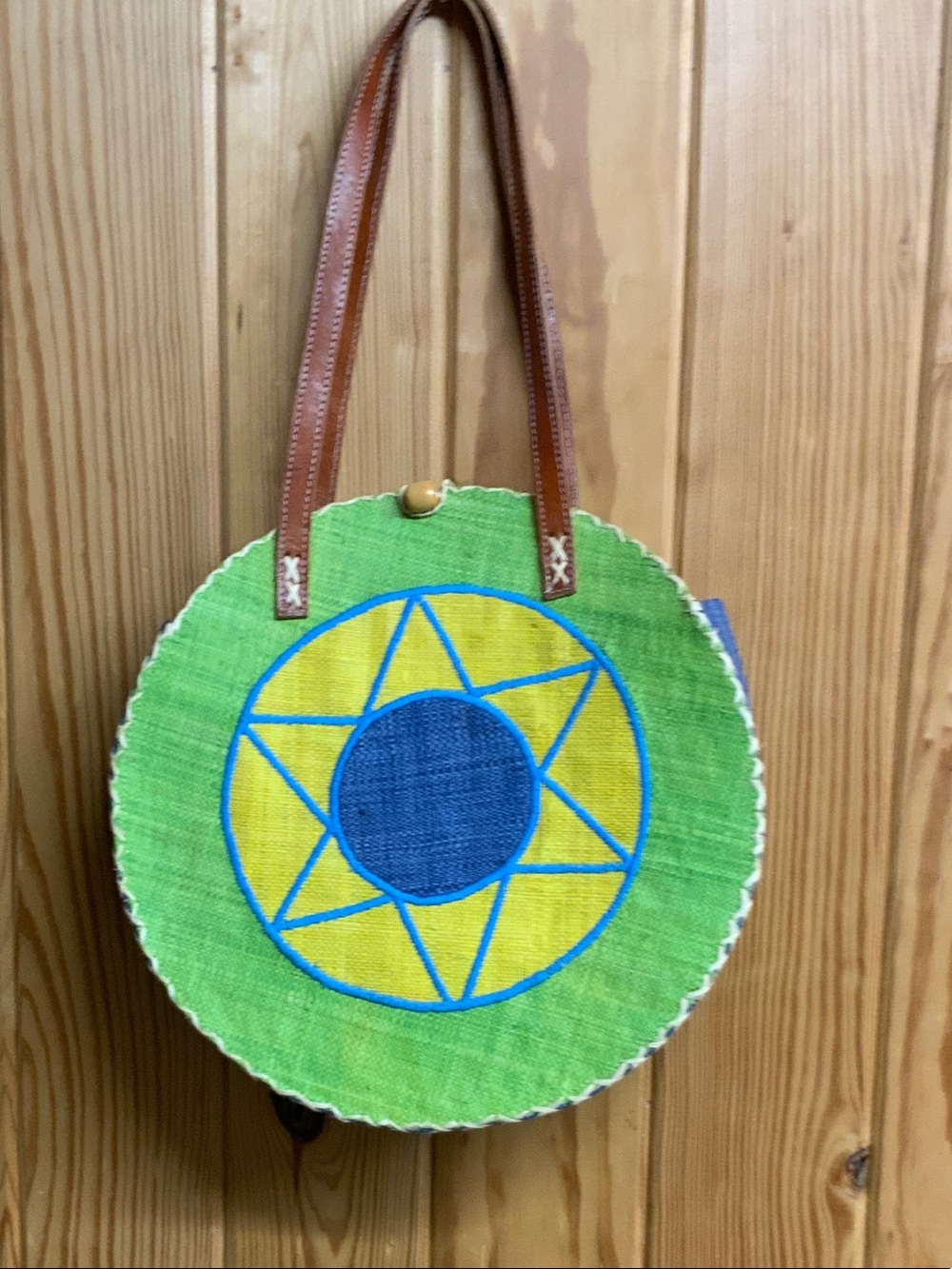 Green Straw Round Tote with Blue & Yellow Sunburst Accent